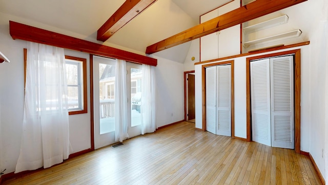 unfurnished bedroom with access to exterior, vaulted ceiling with beams, multiple closets, visible vents, and light wood-style flooring