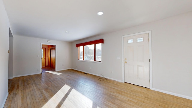 interior space with recessed lighting, light wood-type flooring, and baseboards