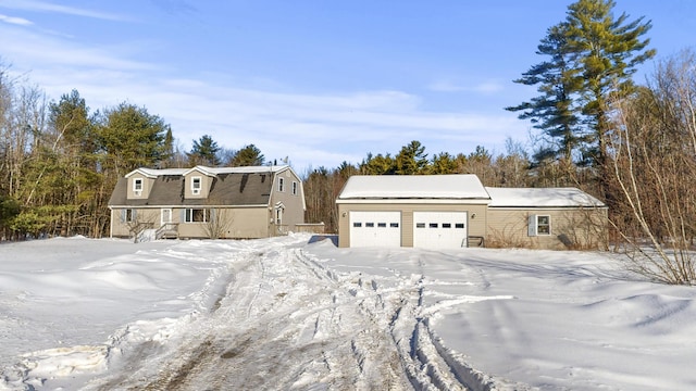 colonial inspired home with a garage and a gambrel roof