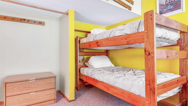 carpeted bedroom with baseboards