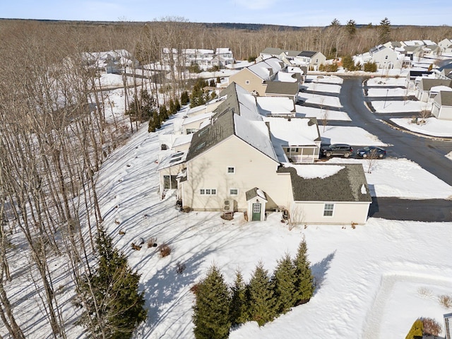 snowy aerial view featuring a residential view