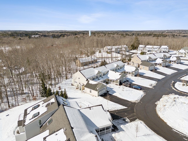 snowy aerial view featuring a residential view