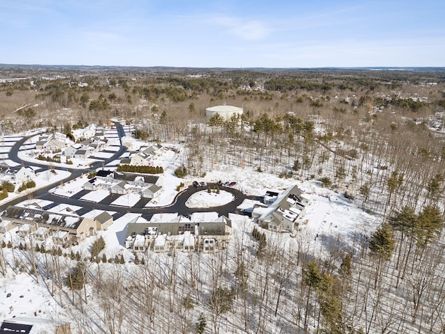 snowy aerial view with a residential view