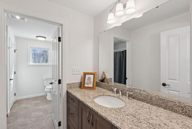 bathroom with toilet, baseboards, visible vents, and vanity