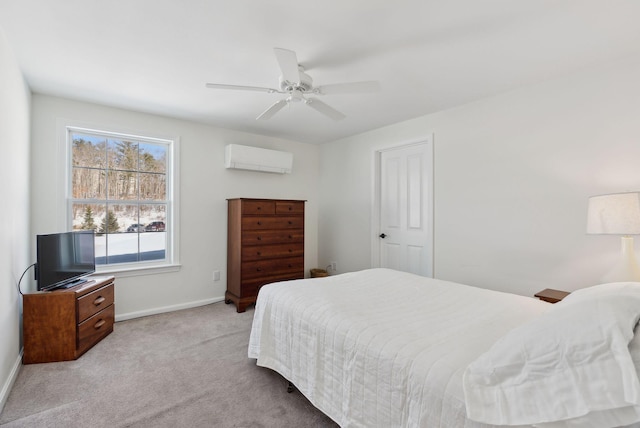 carpeted bedroom featuring a ceiling fan, a wall mounted air conditioner, and baseboards