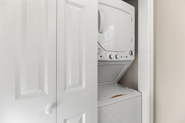 washroom with laundry area and stacked washer and clothes dryer