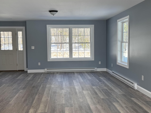 entryway with a baseboard radiator, baseboards, and dark wood-type flooring