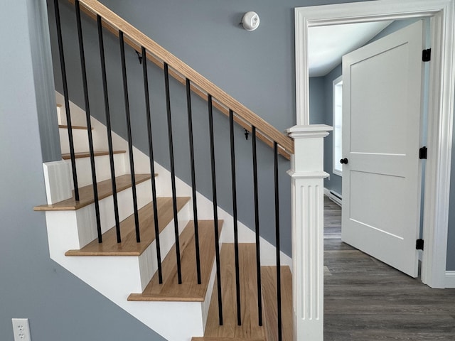 staircase with wood finished floors