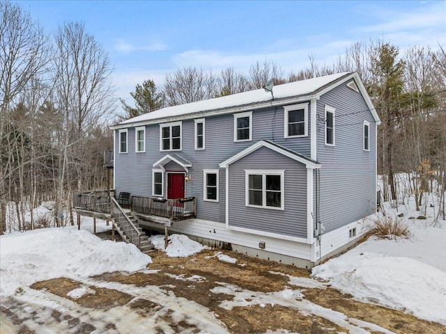 view of front of home with stairs and a wooden deck