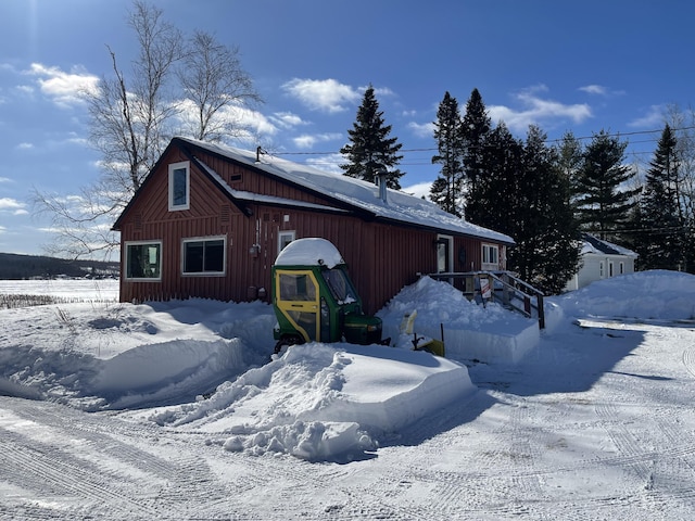 view of snowy exterior featuring board and batten siding