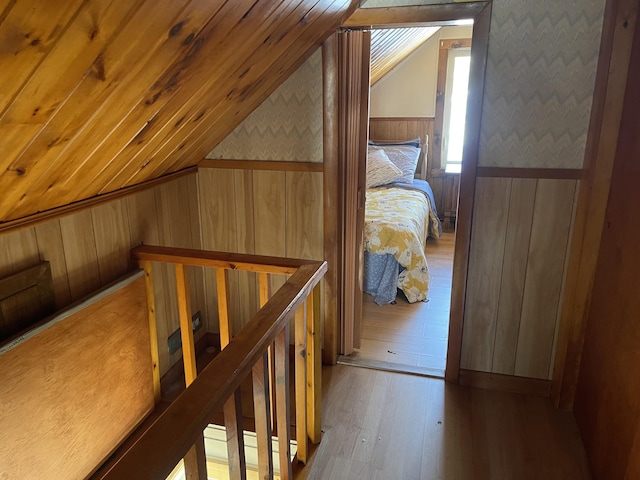 additional living space featuring wooden ceiling, vaulted ceiling, and wood finished floors