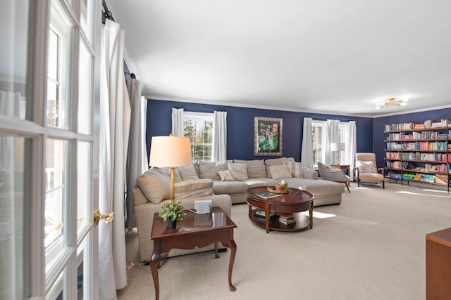 carpeted living area featuring ornamental molding