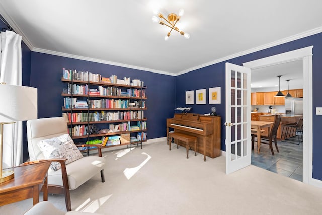 sitting room featuring carpet floors, french doors, crown molding, and baseboards