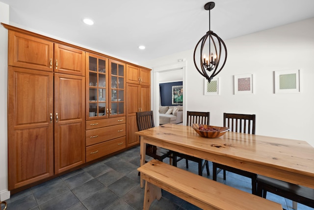 dining space featuring recessed lighting and a notable chandelier