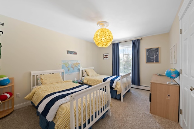 bedroom with carpet and a baseboard radiator