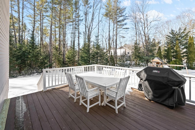 wooden deck featuring outdoor dining area and area for grilling