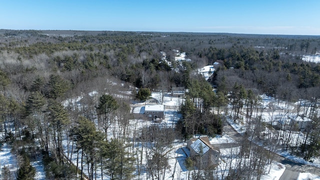 snowy aerial view with a view of trees