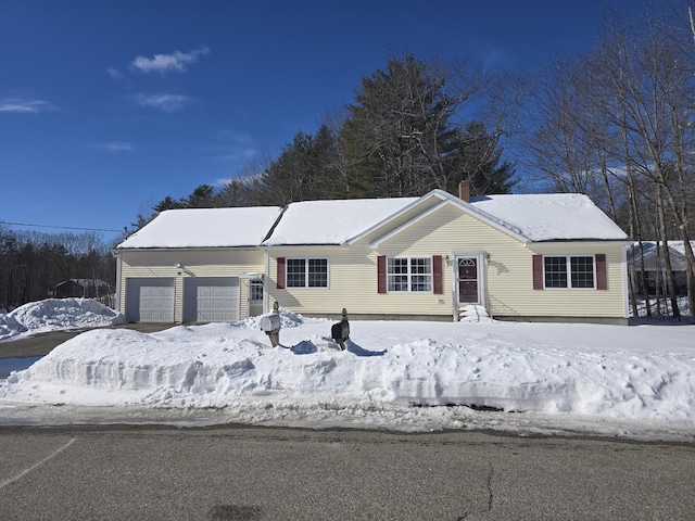 single story home featuring entry steps and a garage