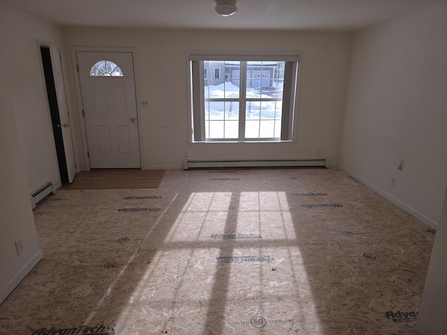 foyer entrance with baseboards and baseboard heating