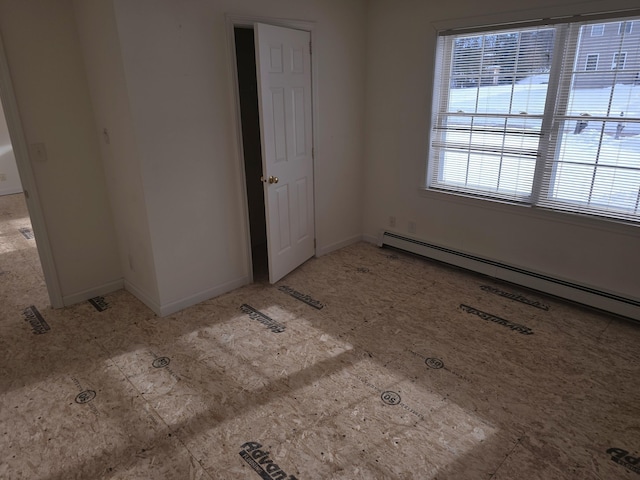 interior space featuring baseboard heating and baseboards