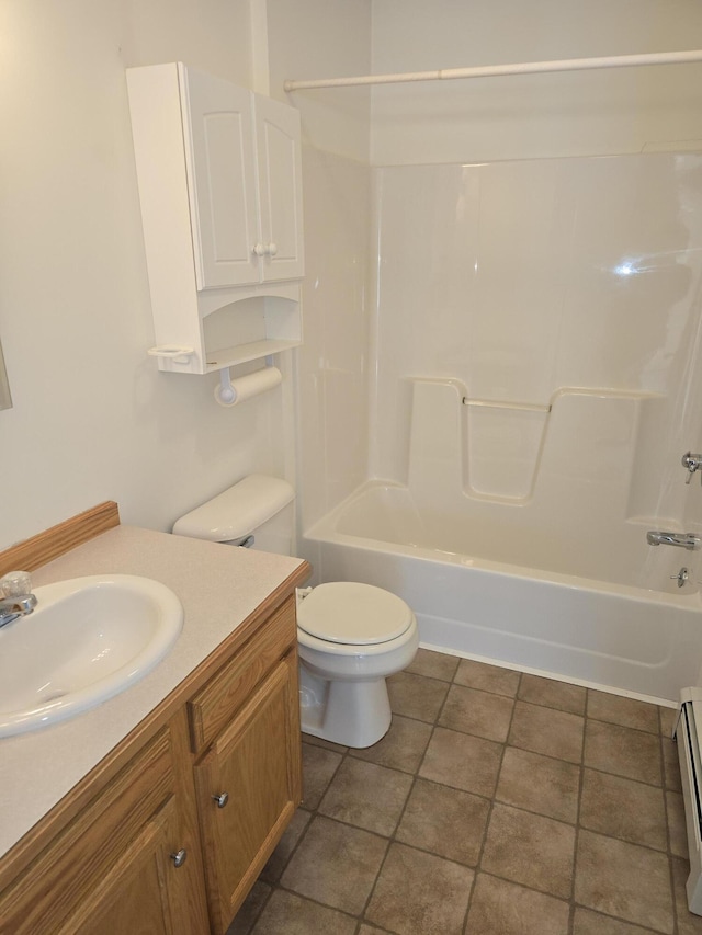 bathroom featuring toilet, a baseboard radiator, vanity, and shower / bathtub combination