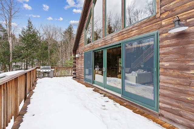 snow covered deck featuring grilling area