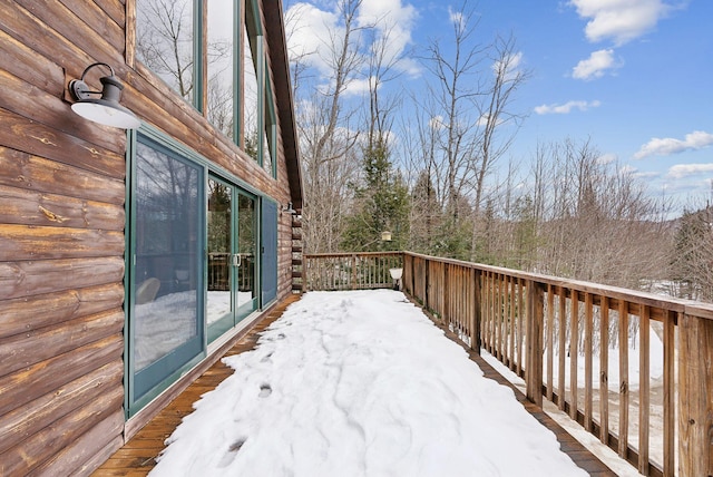 view of snow covered deck