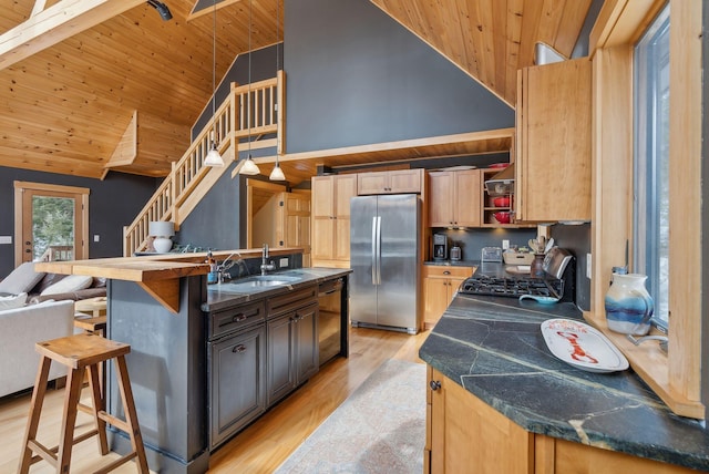 kitchen with light wood finished floors, wooden ceiling, freestanding refrigerator, open shelves, and a sink