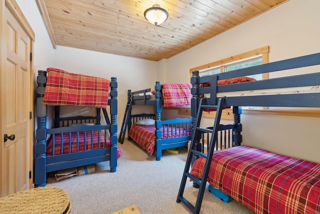 carpeted bedroom with wooden ceiling