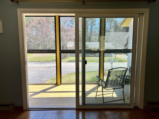 doorway to outside with wood finished floors