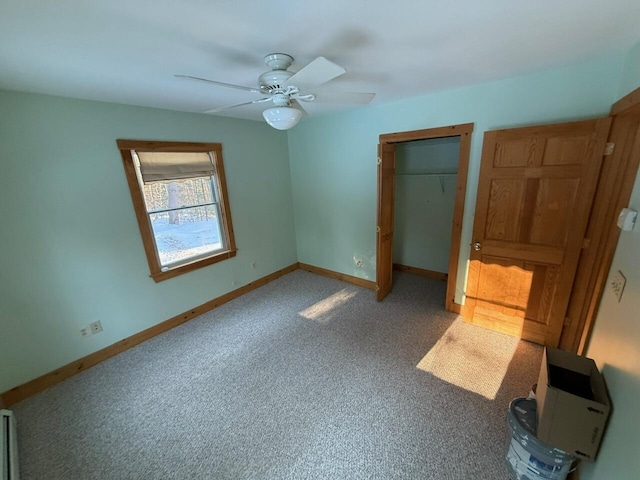 unfurnished bedroom featuring ceiling fan, carpet floors, a closet, and baseboards