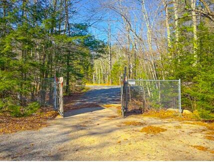 view of gate featuring fence