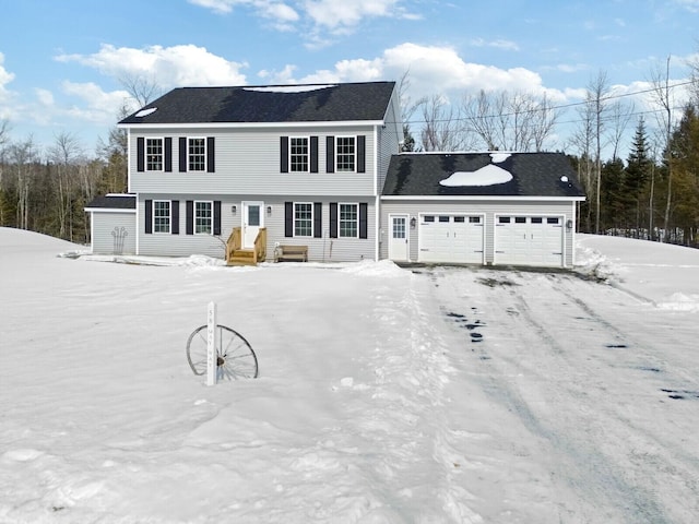 colonial house featuring an attached garage