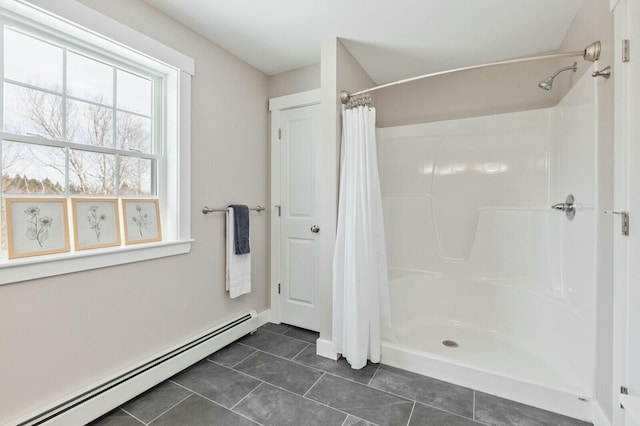 bathroom with a shower with curtain, a baseboard radiator, and tile patterned flooring