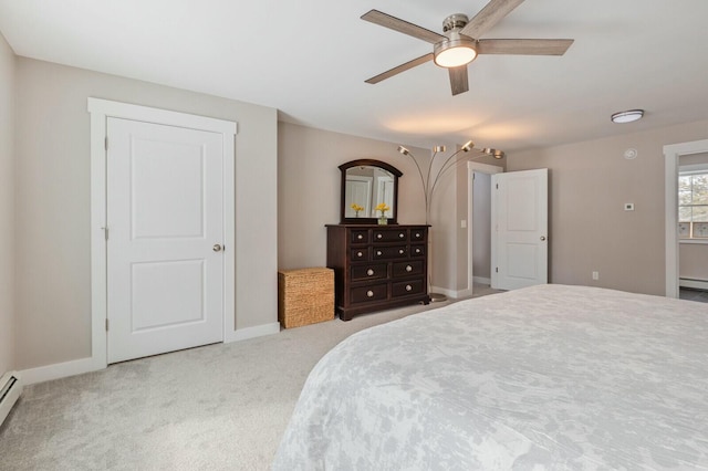 carpeted bedroom featuring a ceiling fan, a baseboard radiator, a baseboard heating unit, and baseboards