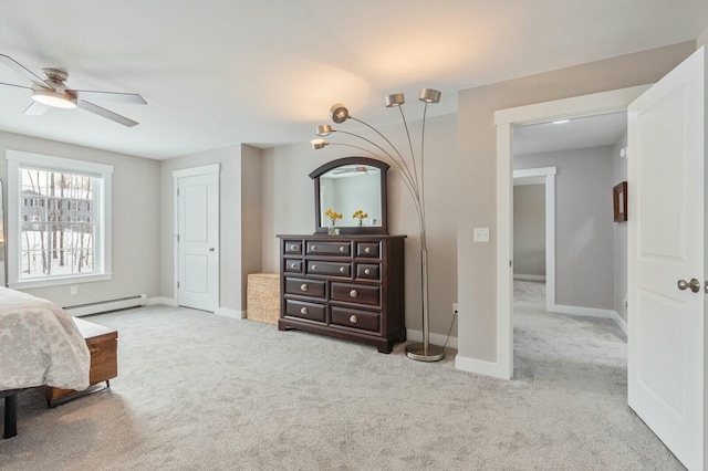 bedroom with a baseboard radiator, carpet flooring, ceiling fan, and baseboards