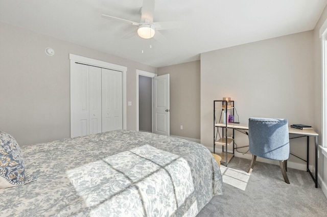 bedroom with carpet floors, baseboards, a ceiling fan, and a closet