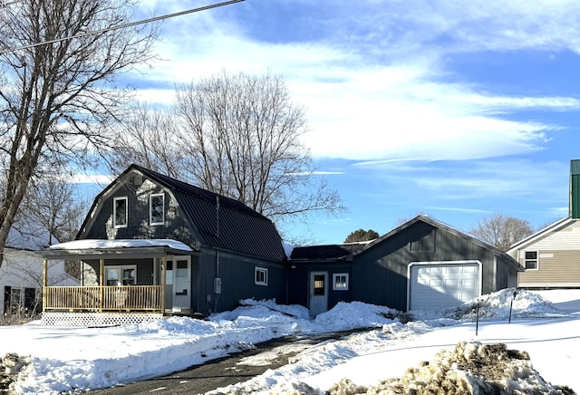 dutch colonial featuring a porch and a gambrel roof