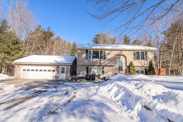 split foyer home featuring a garage and driveway