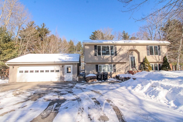 split foyer home with a garage and driveway