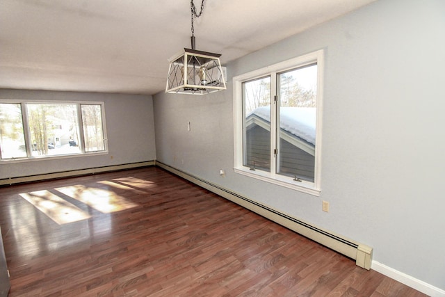 unfurnished room featuring dark wood-type flooring, a wealth of natural light, a baseboard heating unit, and baseboard heating