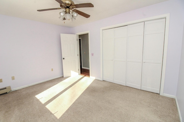 unfurnished bedroom featuring light carpet, a closet, a ceiling fan, and baseboards