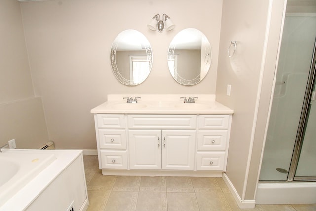 full bath featuring double vanity, a shower stall, a sink, and tile patterned floors