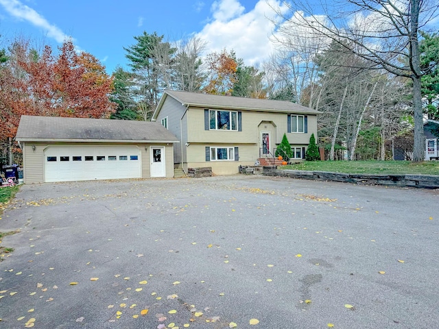 bi-level home with a garage and driveway