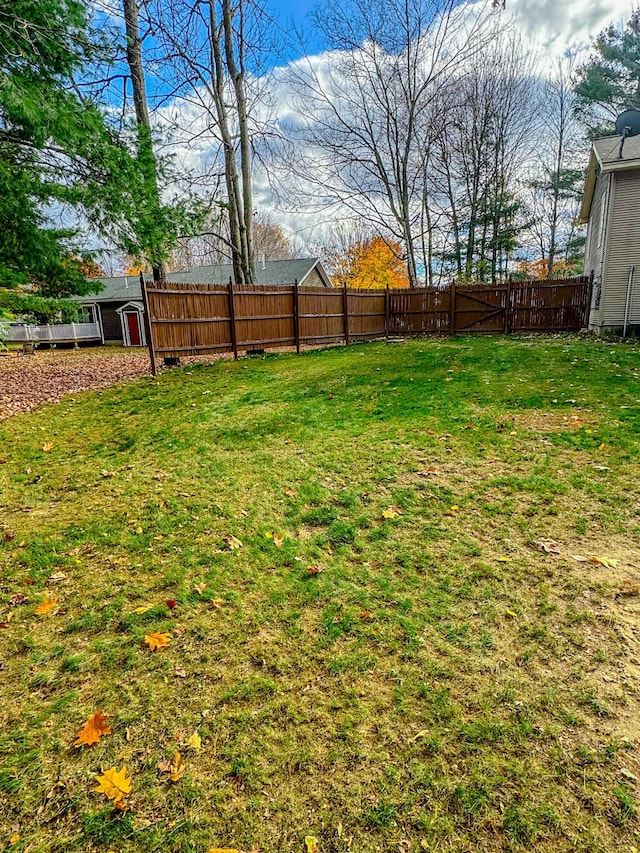 view of yard with a fenced backyard