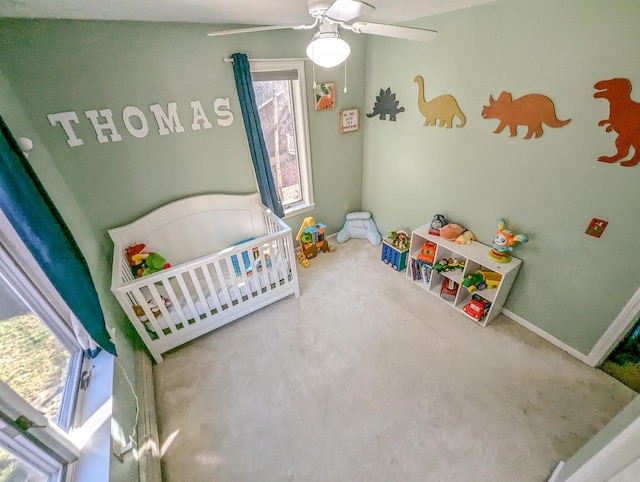 carpeted bedroom featuring a ceiling fan and baseboards