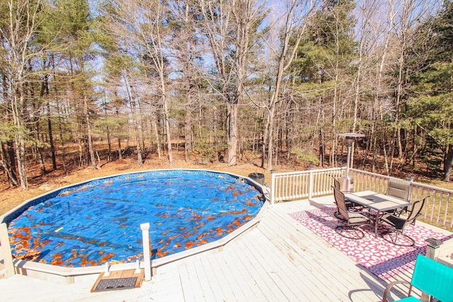 19 Shannon Dr, Bangor, ME 04401 - view of swimming pool with a wooden deck and outdoor dining space