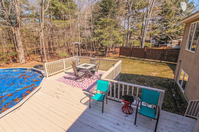 19 Shannon Dr, Bangor, ME 04401 - wooden terrace featuring outdoor dining area, fence, and a lawn