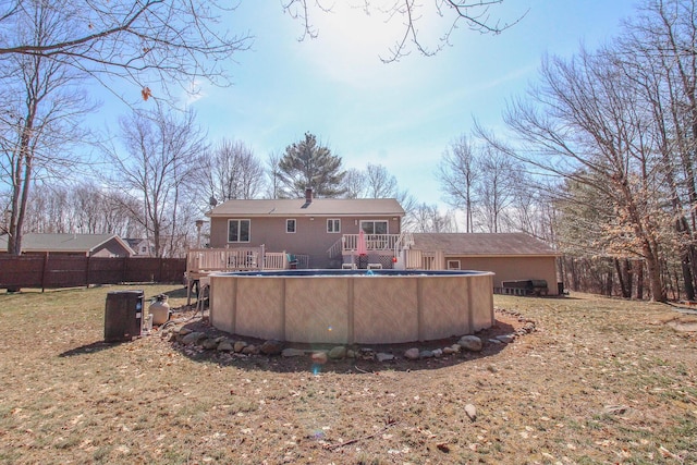19 Shannon Dr, Bangor, ME 04401 - rear view of house featuring a fenced in pool, a wooden deck, and fence