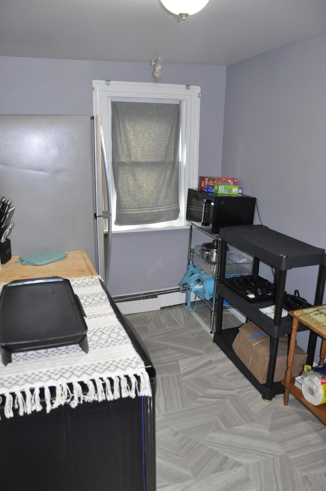 bedroom featuring a baseboard radiator